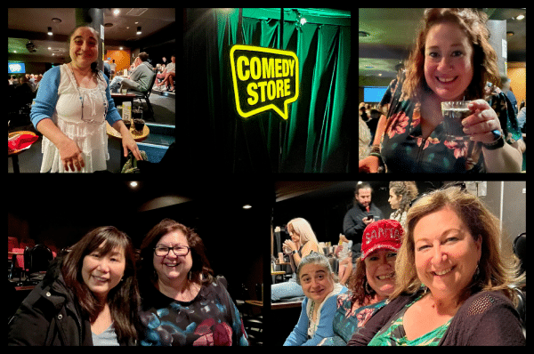 The TMIC team smiling in their seats at The Comedy Store.